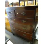 An antique bow front chest of three long & two short drawers