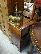 A brass helmet shaped coal scuttle & brass fire irons together with a three-drawer bedside chest