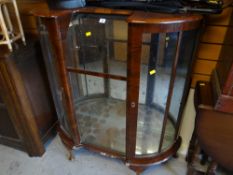 A polished china cabinet, a leather (or effect) pouffe, sundry bamboo, rattan tables etc