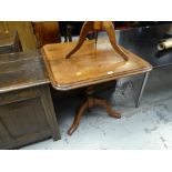 An antique Victorian mahogany tilt-top tripod table