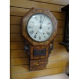 An antique marquetry wall clock