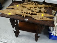 A colonial carved hardwood table & sundry carved tourist spears etc