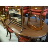 A Victorian mahogany extending oval dining table together with two sets of four similar period