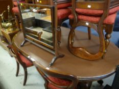 A Victorian mahogany extending oval dining table together with two sets of four similar period