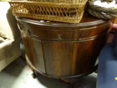 An antique mahogany demi-lune sideboard