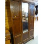 A vintage mirrored single-door wardrobe