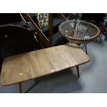 An Ercol-style long-John lightwood coffee table & a circular glass topped coffee table