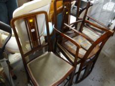 A set of three inlaid mahogany Edwardian bedroom chairs