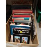 A quantity of reference books for postcard collectors, a pair of commemorative Royal books & a