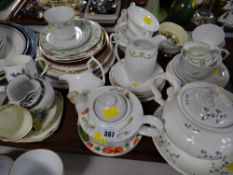 A tray of various patterned vintage teaware, teapots, jugs etc