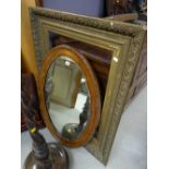 A vintage oval bevelled wall mirror & a good empty gilt picture frame