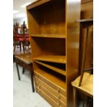 A modern wooden shelving unit with drawers