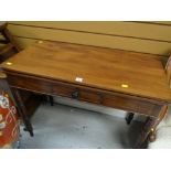 An antique mahogany foldover tea table with single centre drawer