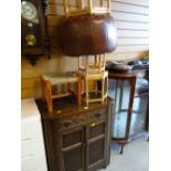 A polished & carved two-door cupboard with drawer