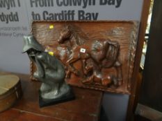 A carved wooden panel of horses & a sculpture of a seated lady, signed & dated 1971