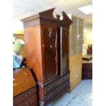 An antique-style mahogany armoire with two base drawers & carved details