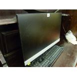 HP flatscreen monitor and a Microsoft keyboard