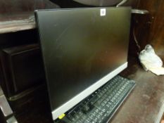 HP flatscreen monitor and a Microsoft keyboard