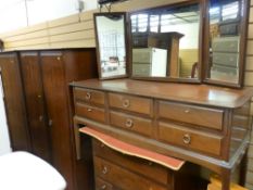 Suite of Stag Minstrel bedroom furniture comprising two wardrobes, dressing table and multi-drawer