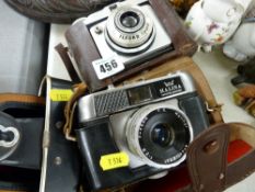 Two vintage cased cameras, one Halina Paulette Electric and another Ilford Sporti