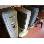 Two halogen heaters, one with remote control and an oil filled radiator E/T