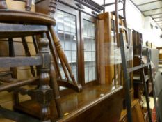 Polished gate leg table and a leaded glass two door bookcase top