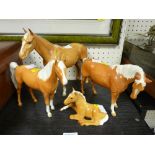 Four Beswick Palomino type horses