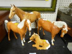 Four Beswick Palomino type horses