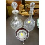 Silver bon bon basket with glass liner and two glass decanters, one with a silver collar