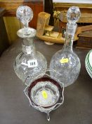 Silver bon bon basket with glass liner and two glass decanters, one with a silver collar