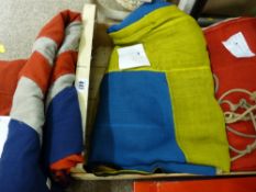 Crate containing naval flags including Union Jack with red ensign, Sweden etc