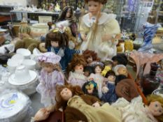 Very large parcel of ornamental dolls, some on stands