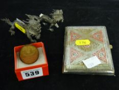 Pair of white metal Oriental dragon figures, cigarette case and a commemorative coin