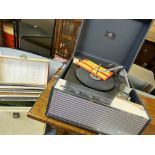 Dynatron 'Carnival' mains portable record player and a quantity of vinyl records in a vintage case