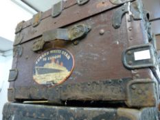 All metal banded trunk with label 'Cunard White Star to Europe, Boston to Liverpool'