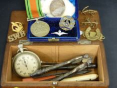 Wooden box of fountain pens, pocket watches, badges, medals etc