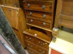 Narrow chest of three long and two short drawers and a similar style single door cupboard