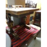 An antique oak extending dining table together with a vintage light oak drawer leaf dining table