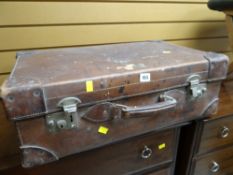 A good vintage brown leather suitcase embossed with natural grain cowhide