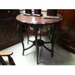 A vintage shaped topped side table with lower shelf