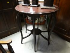 A vintage shaped topped side table with lower shelf