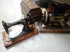 Two cased vintage sewing machines