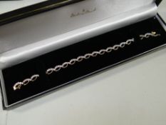 A modern diamond bracelet set in 9ct yellow gold, 8grms