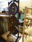 A vintage oak folding cake stand