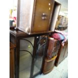 A vintage glass two-door display cabinet together with a bedside cabinet