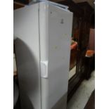 An Indesit upright fridge in white E/T