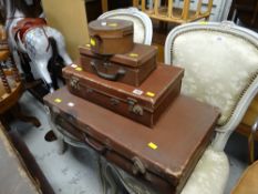 Three vintage leather suitcases together with a leather collar box