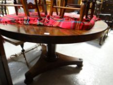A good antique Georgian circular dark wood dining table with column support & tripod rosette