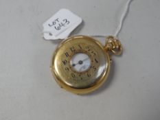 An 18k yellow gold half-hunter pocket watch having a white enamel dial with Arabic numerals &