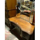 Vintage polished wood concave front dressing table with a tri-fold mirror